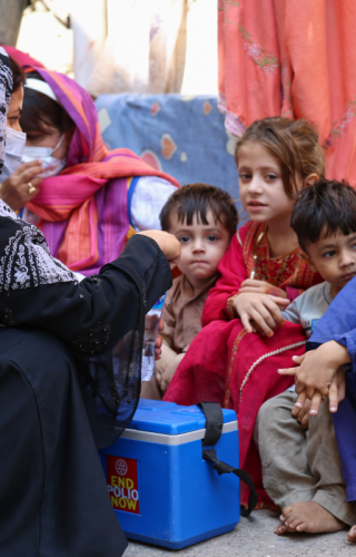 Health workers immunize children during a national immunization day in Rawalpindi, Punjab, Pakistan.